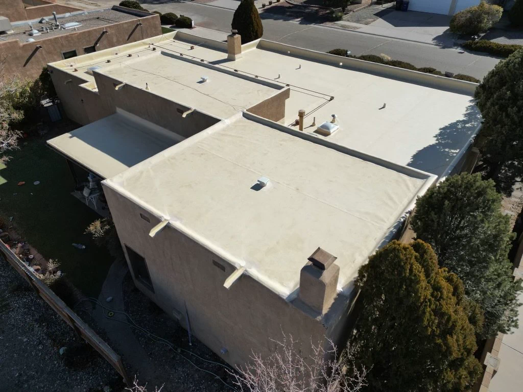 Aerial view of a finished TPO flat roof on a New Mexico home