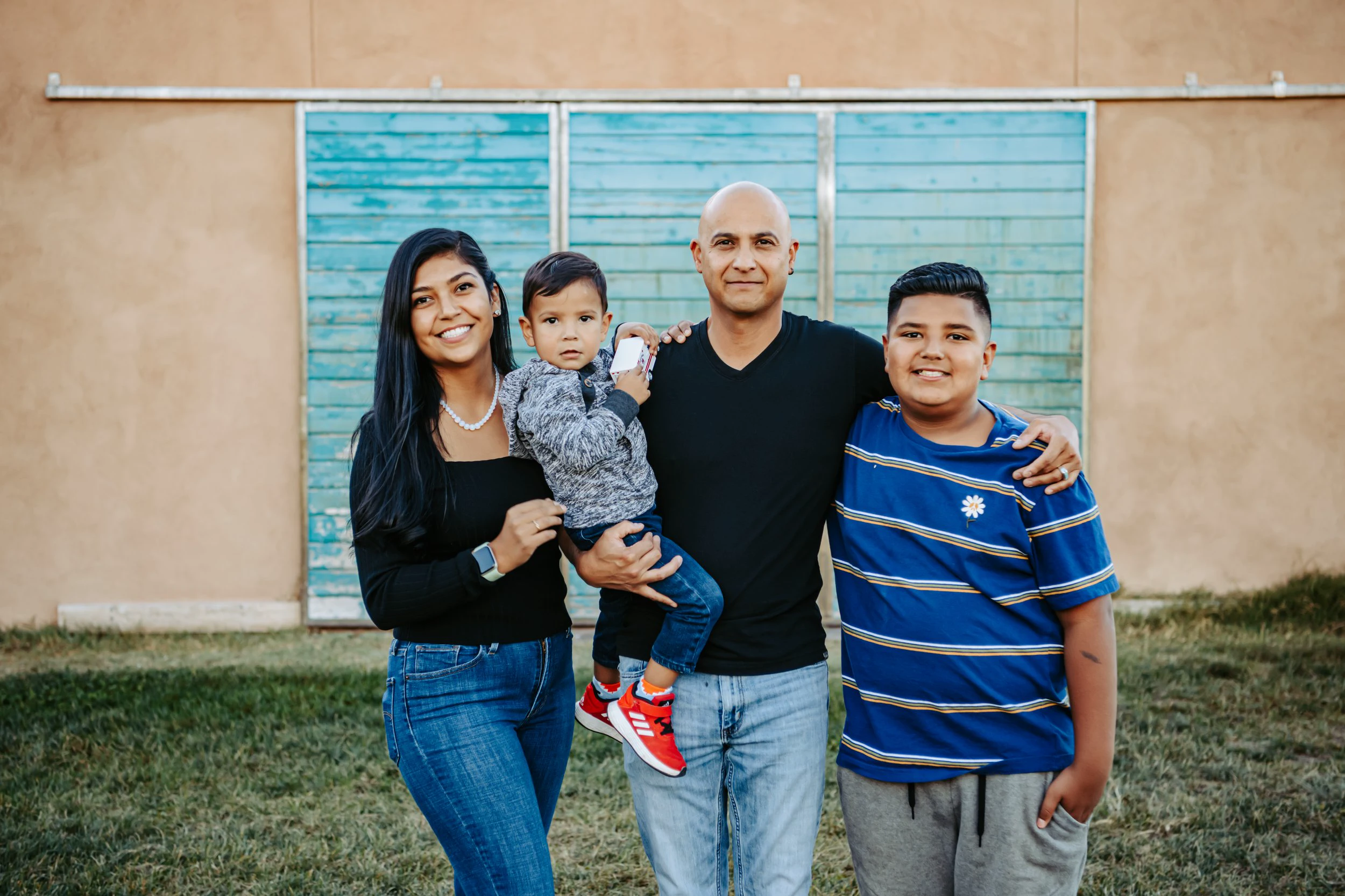 James Pacheco, owner of Desert Storm Roofing, with his family